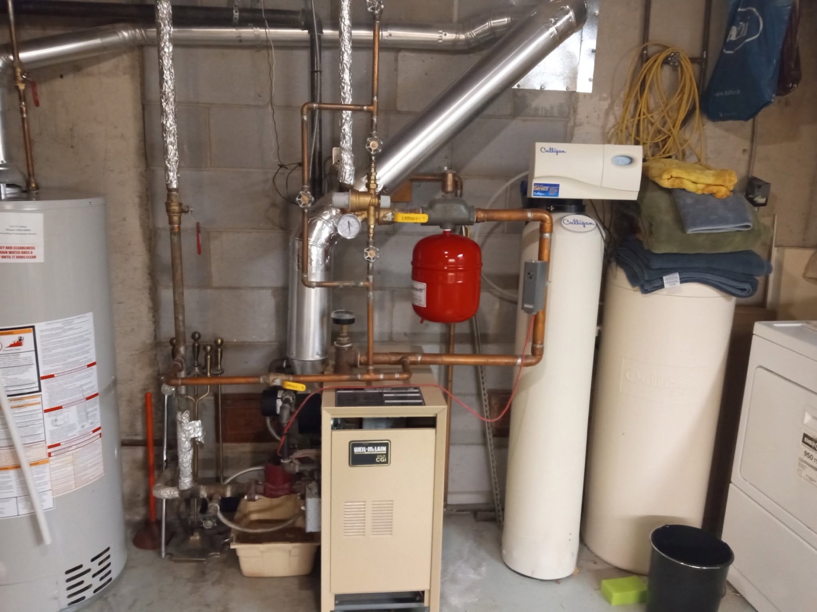 Furnace, boiler and water softener in a mechanical room serviced by Penberg Mechanical