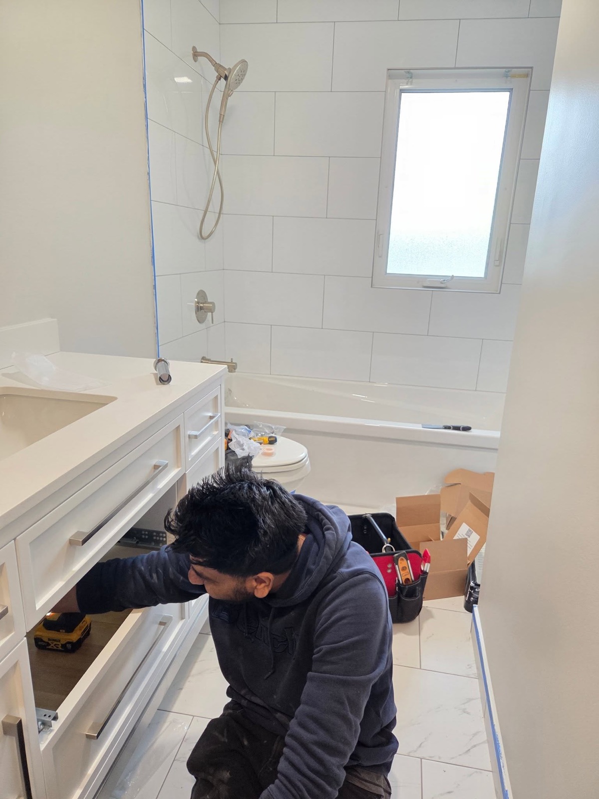 Penberg Mechanical technician installing a bathroom vanity